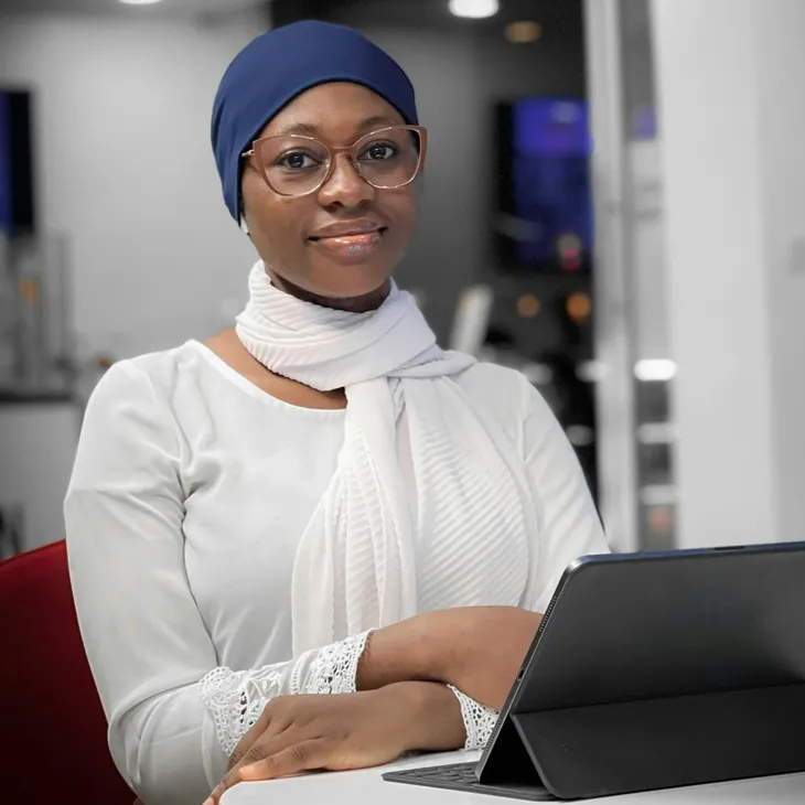 A lady working in front of a laptop