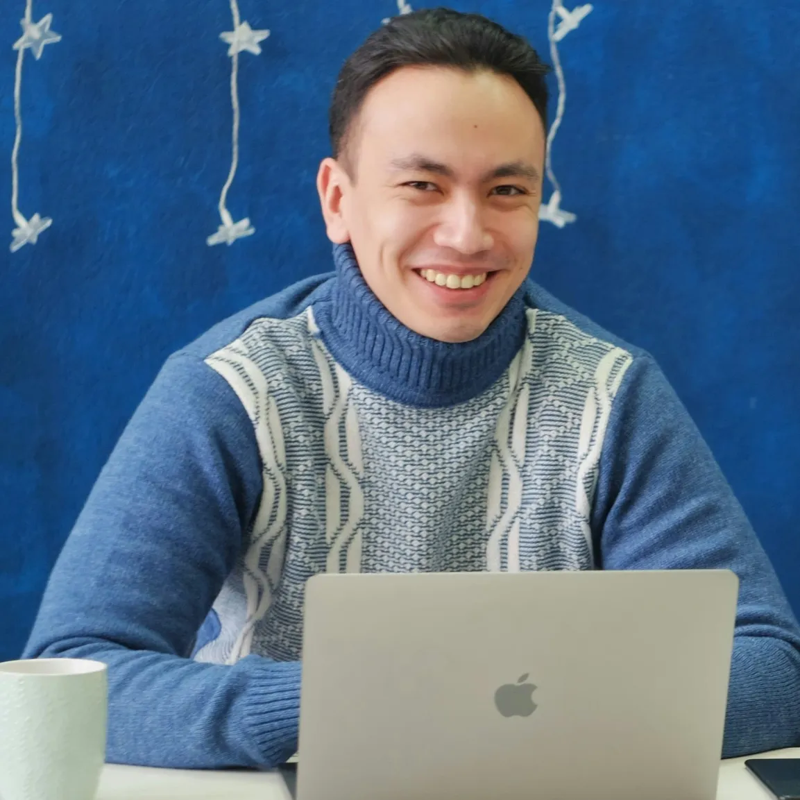 A man working in front of his laptop